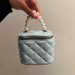 Elegant Blue Quilted Handbag with Pearl Handle